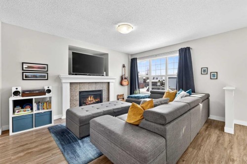 586 Evermeadow Road Sw, Calgary, AB - Indoor Photo Showing Living Room With Fireplace