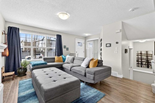 586 Evermeadow Road Sw, Calgary, AB - Indoor Photo Showing Living Room