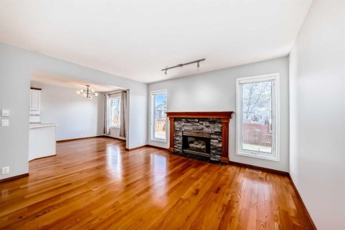 128 Harvest Park Road Ne, Calgary, AB - Indoor Photo Showing Living Room With Fireplace