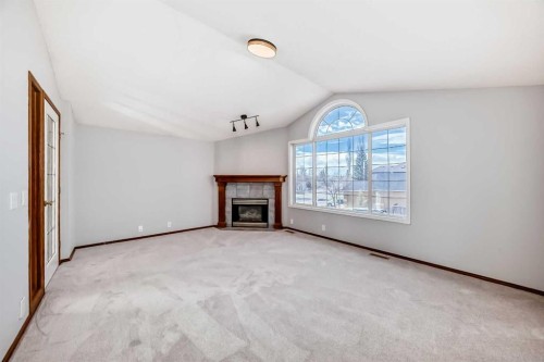 128 Harvest Park Road Ne, Calgary, AB - Indoor With Fireplace