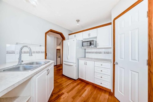 128 Harvest Park Road Ne, Calgary, AB - Indoor Photo Showing Kitchen With Double Sink