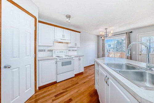 128 Harvest Park Road Ne, Calgary, AB - Indoor Photo Showing Kitchen With Double Sink