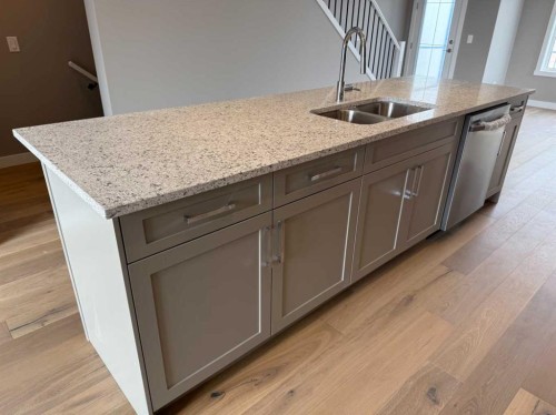 24 Sundown Place, Cochrane, AB - Indoor Photo Showing Kitchen With Double Sink
