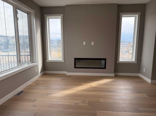 24 Sundown Place, Cochrane, AB - Indoor With Fireplace