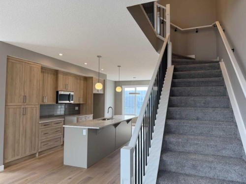 24 Sundown Place, Cochrane, AB - Indoor Photo Showing Kitchen