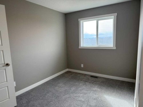 24 Sundown Place, Cochrane, AB - Indoor Photo Showing Other Room