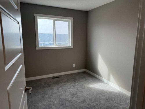 24 Sundown Place, Cochrane, AB - Indoor Photo Showing Other Room