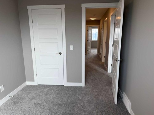 24 Sundown Place, Cochrane, AB - Indoor Photo Showing Other Room