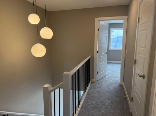 24 Sundown Place, Cochrane, AB - Indoor Photo Showing Other Room