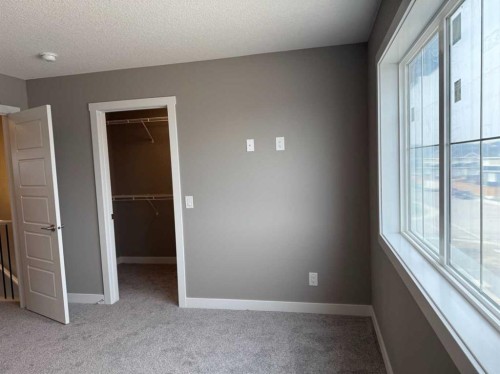 24 Sundown Place, Cochrane, AB - Indoor Photo Showing Other Room