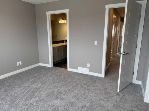24 Sundown Place, Cochrane, AB - Indoor Photo Showing Other Room