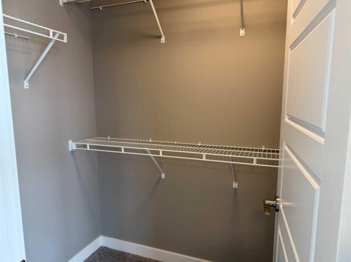 24 Sundown Place, Cochrane, AB - Indoor With Storage