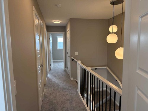 24 Sundown Place, Cochrane, AB - Indoor Photo Showing Other Room