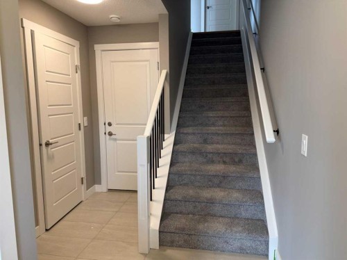 24 Sundown Place, Cochrane, AB - Indoor Photo Showing Other Room