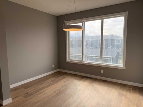 24 Sundown Place, Cochrane, AB - Indoor Photo Showing Other Room