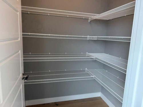 24 Sundown Place, Cochrane, AB - Indoor With Storage