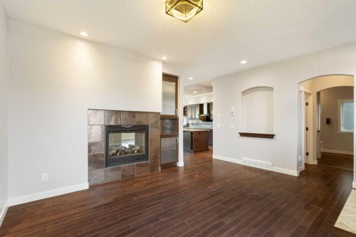 13 Sage Hill Landing Nw, Calgary, AB - Indoor Photo Showing Living Room With Fireplace