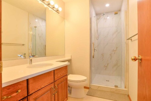 393 Hawktree Circle Nw, Calgary, AB - Indoor Photo Showing Dining Room With Fireplace