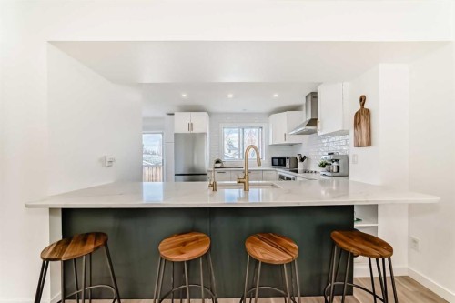 34 River Rock Way Se, Calgary, AB - Indoor Photo Showing Kitchen With Upgraded Kitchen
