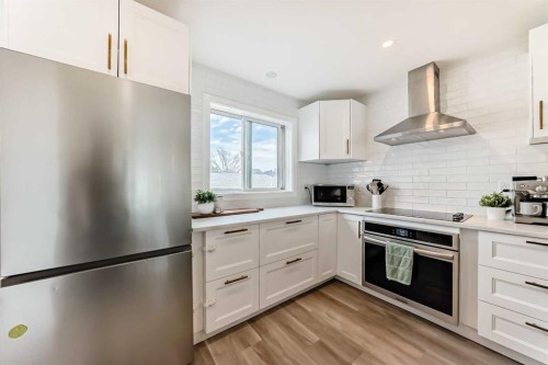 34 River Rock Way Se, Calgary, AB - Indoor Photo Showing Kitchen With Upgraded Kitchen