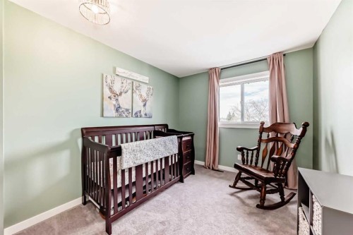 34 River Rock Way Se, Calgary, AB - Indoor Photo Showing Bedroom