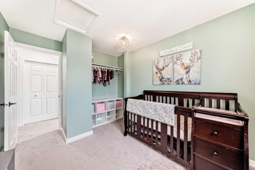34 River Rock Way Se, Calgary, AB - Indoor Photo Showing Bedroom