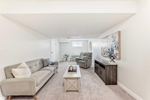 34 River Rock Way Se, Calgary, AB - Indoor Photo Showing Living Room