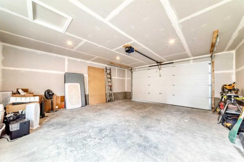 34 River Rock Way Se, Calgary, AB - Indoor Photo Showing Garage