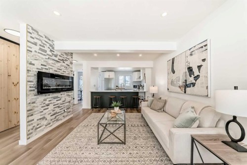 34 River Rock Way Se, Calgary, AB - Indoor Photo Showing Living Room With Fireplace