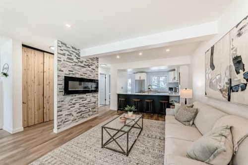 34 River Rock Way Se, Calgary, AB - Indoor Photo Showing Living Room With Fireplace