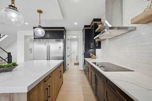 180 South Shore, Chestermere, AB - Indoor Photo Showing Kitchen With Upgraded Kitchen