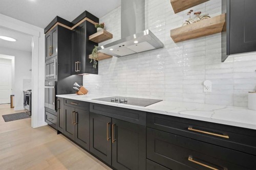 180 South Shore, Chestermere, AB - Indoor Photo Showing Kitchen With Upgraded Kitchen