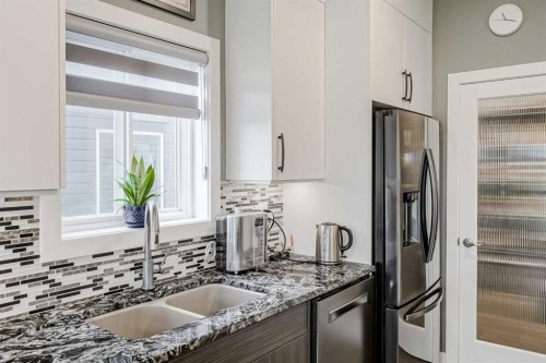 32 Legacy Cove Se, Calgary, AB - Indoor Photo Showing Kitchen With Double Sink With Upgraded Kitchen