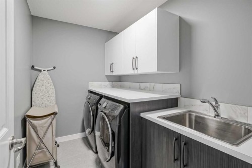 32 Legacy Cove Se, Calgary, AB - Indoor Photo Showing Laundry Room
