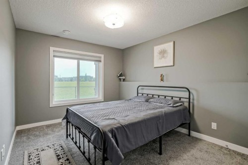 32 Legacy Cove Se, Calgary, AB - Indoor Photo Showing Bedroom
