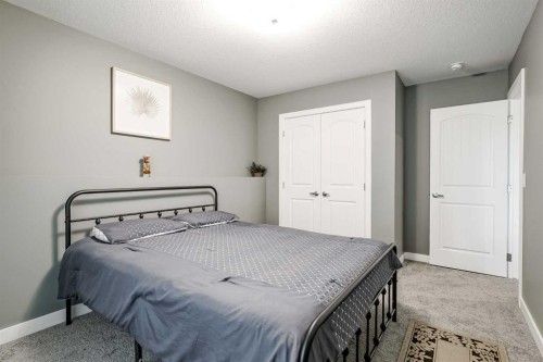 32 Legacy Cove Se, Calgary, AB - Indoor Photo Showing Bedroom
