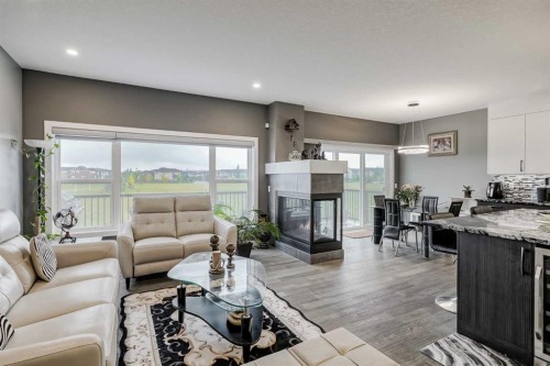 32 Legacy Cove Se, Calgary, AB - Indoor Photo Showing Living Room With Fireplace
