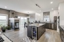 32 Legacy Cove Se, Calgary, AB  - Indoor Photo Showing Kitchen With Fireplace With Upgraded Kitchen 