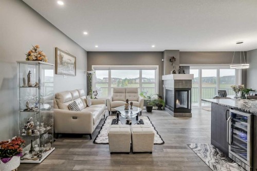 32 Legacy Cove Se, Calgary, AB - Indoor Photo Showing Living Room With Fireplace
