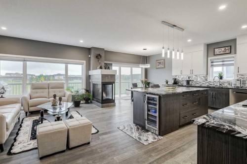 32 Legacy Cove Se, Calgary, AB - Indoor Photo Showing Living Room With Fireplace