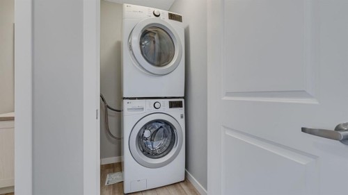 205 Sundown Road, Cochrane, AB - Indoor Photo Showing Laundry Room