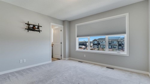 205 Sundown Road, Cochrane, AB - Indoor Photo Showing Other Room