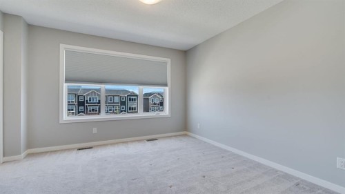 205 Sundown Road, Cochrane, AB - Indoor Photo Showing Other Room