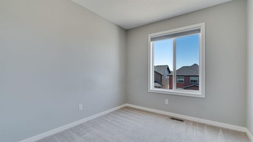 205 Sundown Road, Cochrane, AB - Indoor Photo Showing Other Room