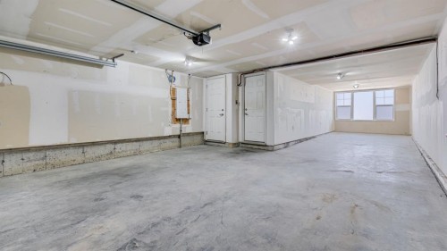 205 Sundown Road, Cochrane, AB - Indoor Photo Showing Garage