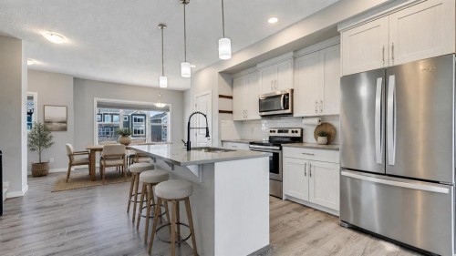 205 Sundown Road, Cochrane, AB - Indoor Photo Showing Kitchen With Upgraded Kitchen
