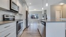 205 Sundown Road, Cochrane, AB  - Indoor Photo Showing Kitchen With Upgraded Kitchen 