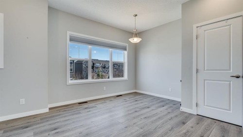 205 Sundown Road, Cochrane, AB - Indoor Photo Showing Other Room
