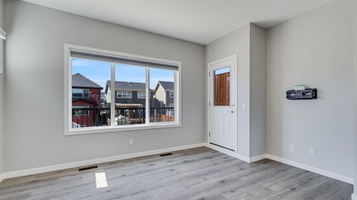 205 Sundown Road, Cochrane, AB - Indoor Photo Showing Other Room