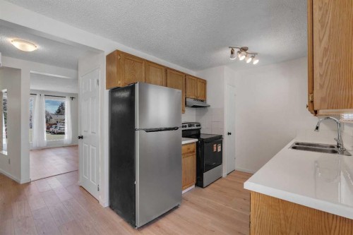 68 Templeson Crescent Ne, Calgary, AB - Indoor Photo Showing Kitchen With Stainless Steel Kitchen With Double Sink